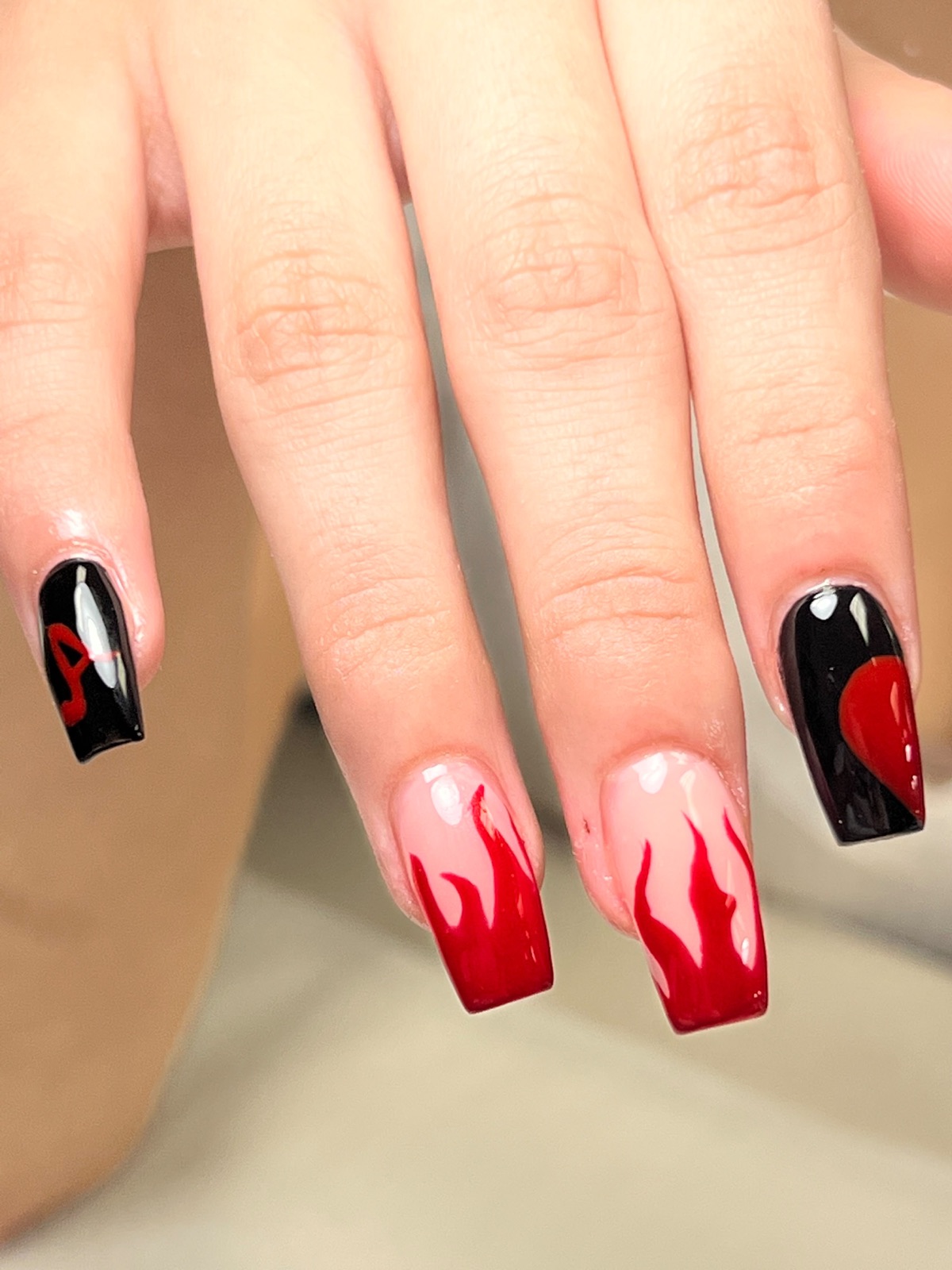 Red and black flame nail art