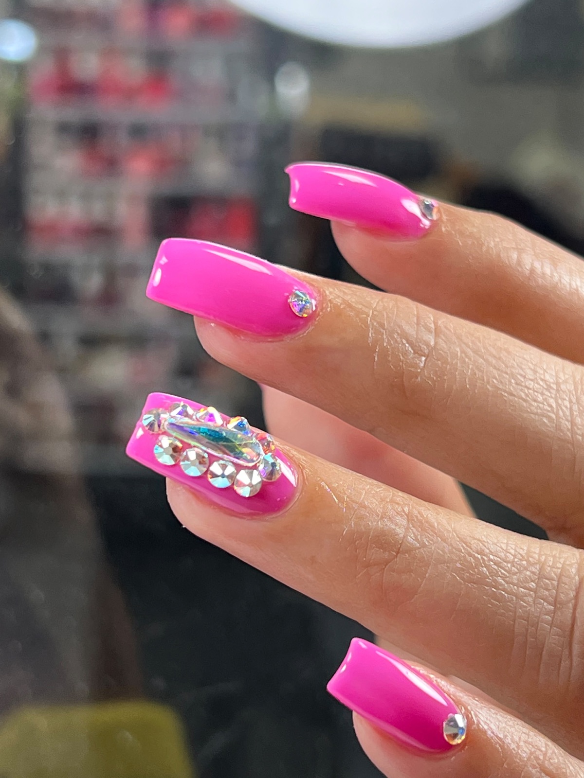 Hot pink nails with crystal details